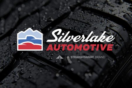 Silverlake Automotive logo over wet tire background, showcasing brand's focus on auto services.